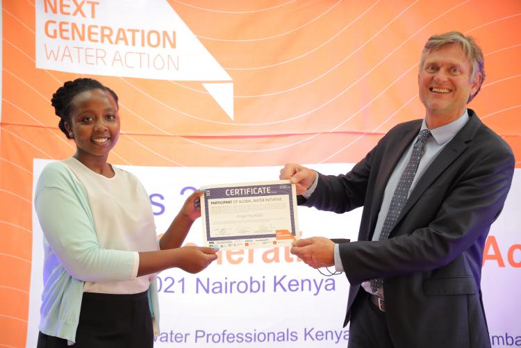 Angela receiving her certificate award from H.E. Ambassador Ole Thonke at Royal Danish Embassy, Muthaiga, Nairobi.