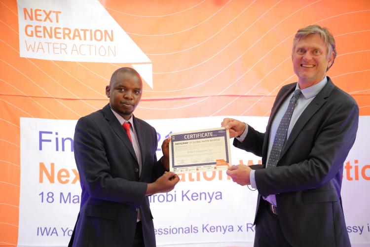 Robert  receiving her certificate award from H.E. Ambassador Ole Thonke at Royal Danish Embassy, Muthaiga, Nairobi.